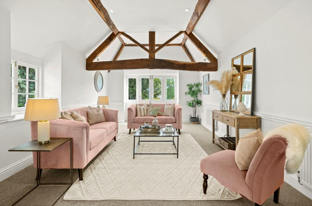 Refurbished period living room with exposed timber trusses
