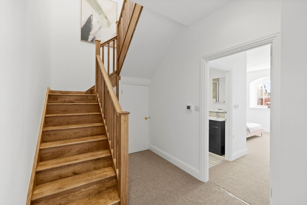 Solid oak staircase with hand shaped handrail